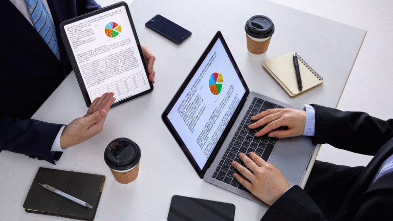 A marketer analyzing customer data on a laptop using predictive analytics tools to optimize digital marketing campaigns.